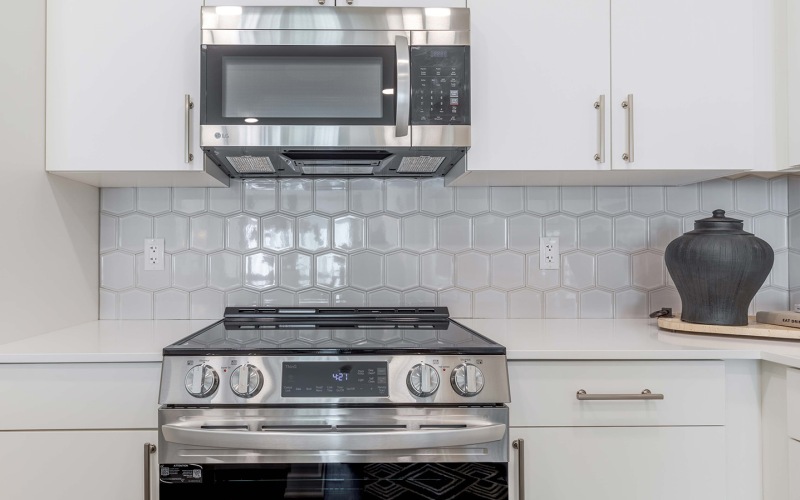 kitchen with white cabinets and stainless steel appliances -  J Veridian at Upper Dublin Fort Washington PA apts 