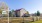 a farmhouse with a sign and fence in front - J Veridian Upper Dublin Fort Washington PA luxury apartments 