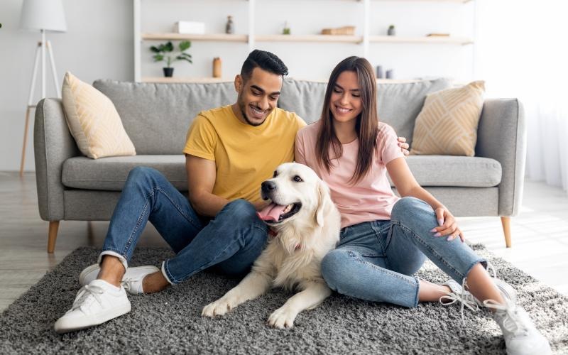 two people sitting in living room  with their dog J Veridian Upper Dublin Fort Washington PA apts 