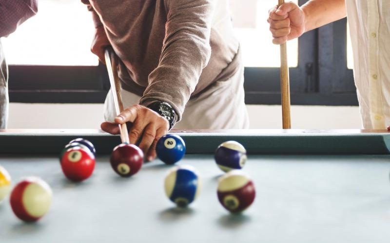 residents playing pool in clubhouse J Veridian Upper Dublin Fort Washington PA apts 